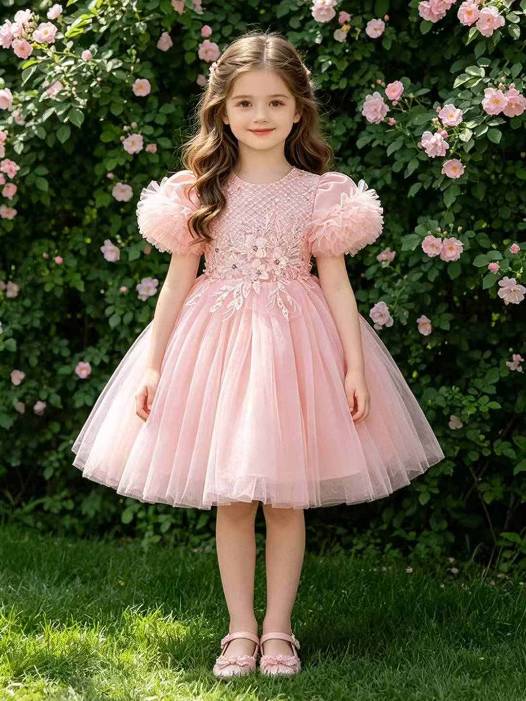Girl in a pink occasion dress